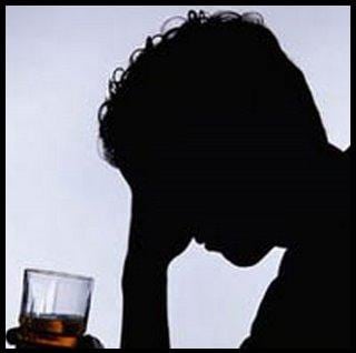 Man clutching alcoholic drink in emotional turmoil - Disease model of addiction concept image