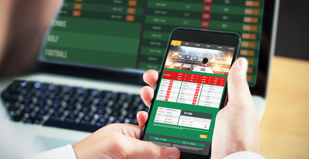 Problem Gamblers betting on smart phone and laptop at the same time